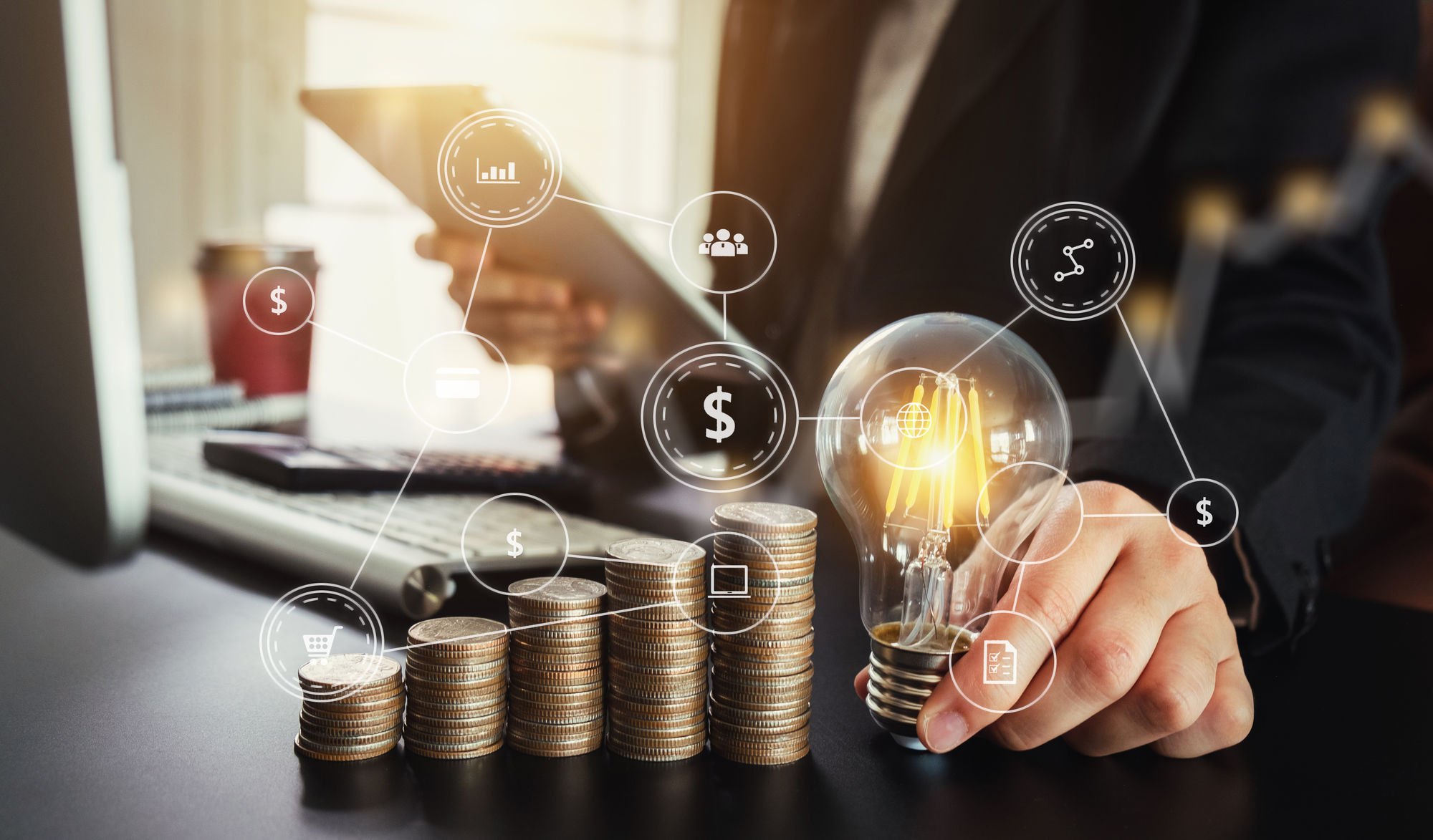 business man hand holding lightbulb with using smartphone and ca